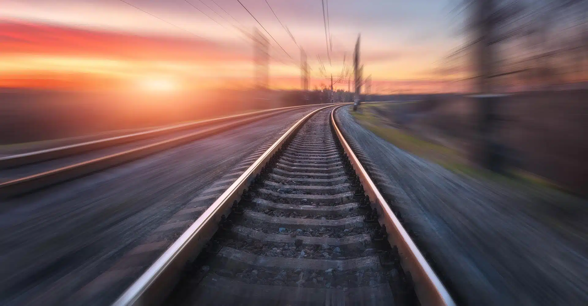Railroad in motion at sunset