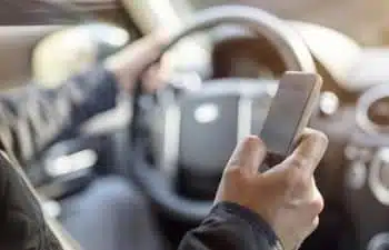a man texting while driving